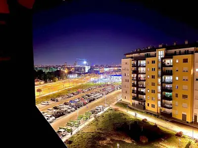 a view of a parking lot at night at Cosy Retreat 135 in Belgrade