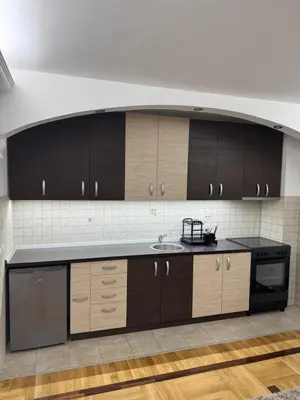 a kitchen with a sink and a counter top at Apartman Centar in Obrenovac