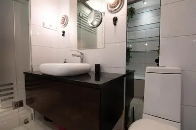 a bathroom with a sink and a toilet at Astra Apartment in Belgrade