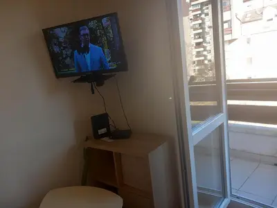 a flat screen tv on a wall in a room at Djordje in Belgrade