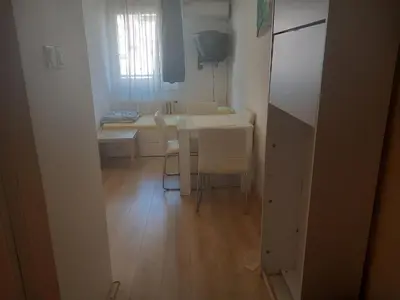 a small room with a table and a table and chairs at Djordje in Belgrade