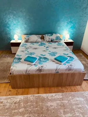 a bedroom with a bed with two pillows on it at Vračarska kućica in Belgrade