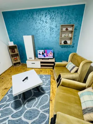 a living room with a couch and a table at Vračarska kućica in Belgrade