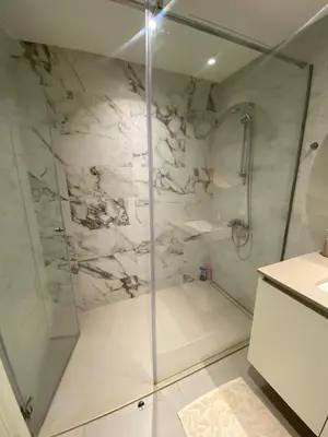 a shower with a glass door in a bathroom at BW Arcadia Apartments - Beograd na vodi in Belgrade