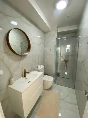 a bathroom with a sink and a shower and a toilet at BW Arcadia Apartments - Beograd na vodi in Belgrade