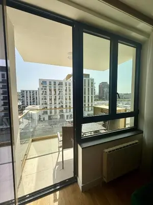 a room with a window with a view of a city at Q4 Comfort Apartment in Belgrade