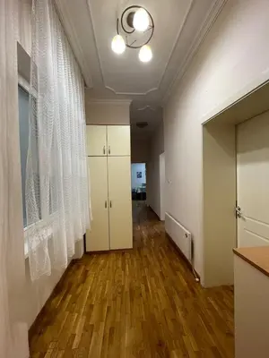 an empty room with white walls and wood floors at Sunlight House in Belgrade