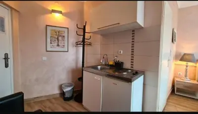 a kitchen with a sink and a counter top at Visoki Stevan Apartments in Belgrade