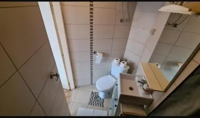 a small bathroom with a toilet and a sink at Visoki Stevan Apartments in Belgrade