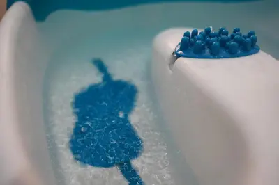 a cake with a blue object on top of it at Jacuzzi Sensation in Belgrade