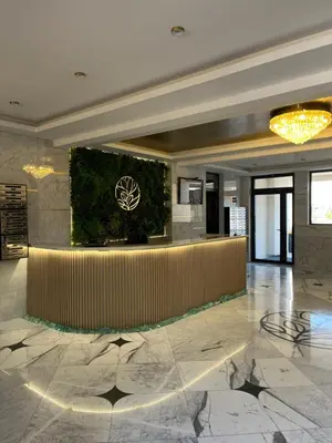 a lobby with a reception desk in a building at Magnolia in Belgrade