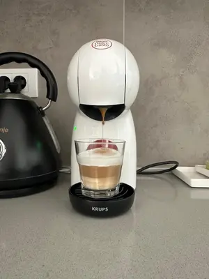 a coffee maker sitting on a counter with a cup of coffee at BW Aqua LUX, river view, parking free in Belgrade