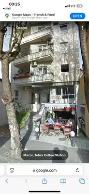 a picture of a building with a table and chairs at Za studente 15 marta in Belgrade