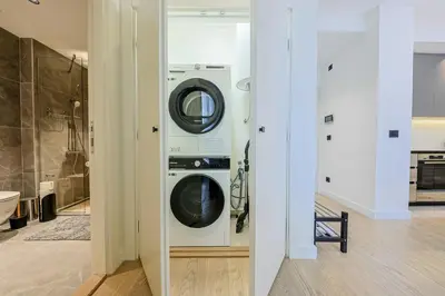 a laundry room with a washer and dryer at ZIGZAG Belgrade Waterfront - SIMFONIJA 2 in Belgrade