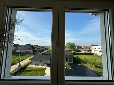 a view from a window of a residential neighborhood at Belgrade Airport Beds in Surčin