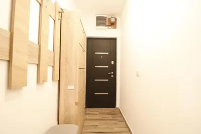 a hallway with a black door in a room at Studio Apartman Valdez 1 in Belgrade