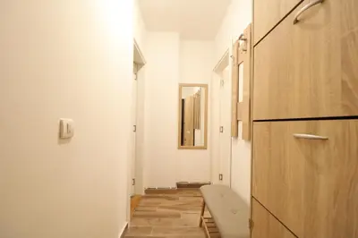 a room with a hallway with a door and a bench at Studio Apartman Valdez 1 in Belgrade