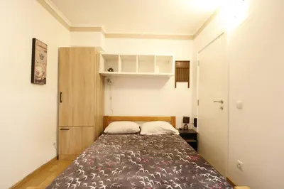 a small bedroom with a bed in a room at Studio Apartman Valdez 1 in Belgrade
