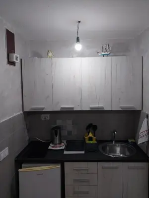 a small kitchen with a sink and a counter top at Drago Sutomore 2025 in Borča