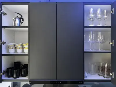 a cabinet with wine glasses in it at Prime Location Modern Luxury in Bohemian Skadarlija! in Belgrade