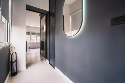 a hallway with a mirror on the wall at Prime Location Modern Luxury in Bohemian Skadarlija! in Belgrade