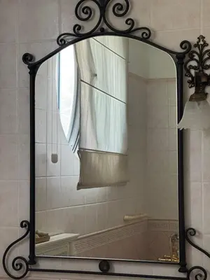 a mirror in a bathroom with a shower at Apartman V Dedinje in Belgrade