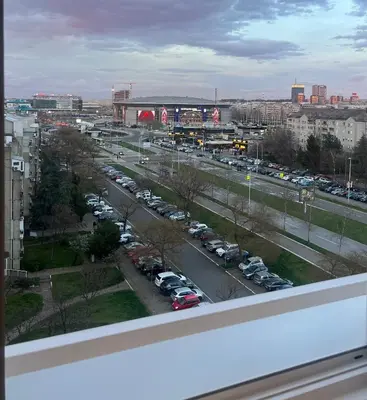 a view of a city with cars parked in a parking lot at Sassy in Belgrade