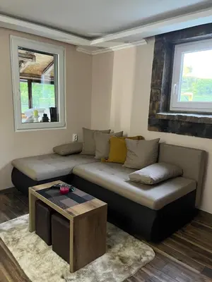 a living room with a couch and a coffee table at Vikend house Cvrcak in Slankamenački Vinogradi