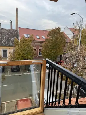 a balcony with a view of a street at Central in Pančevo