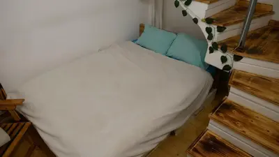a small bedroom with a bed in a tiny house at Terazije apartment in Belgrade