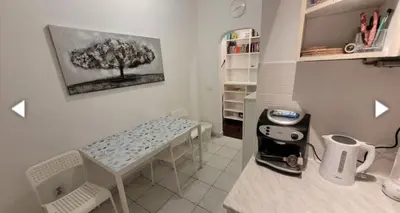 a small room with a table and a sewing machine at Vesna apartment in Belgrade
