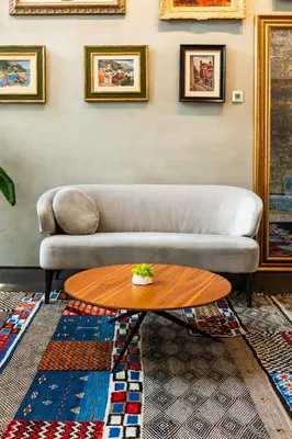 a living room with a couch and a table at Envoy Hotel in Belgrade
