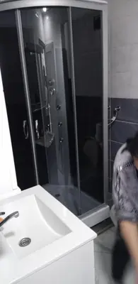 a bathroom with a shower and a white sink at melvina 2 in Pančevo