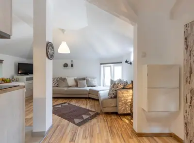 a living room with a couch and a table at Emi Quiet & Cozy Stay in Belgrade