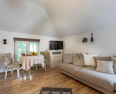 a living room with a couch and a table at Emi Quiet & Cozy Stay in Belgrade