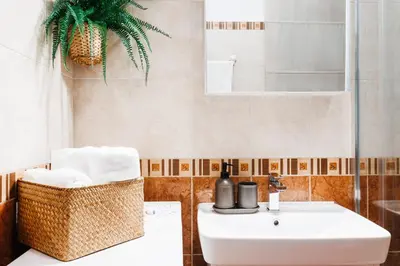 a bathroom with a sink and a mirror at Aesthetic Home with Balcony 5min to Republic Square in Belgrade