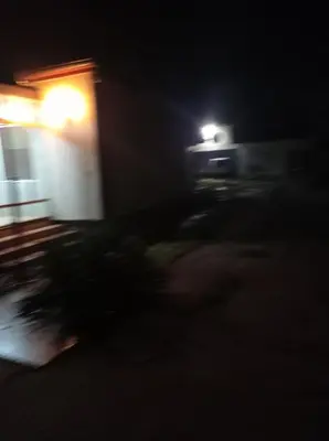 a blurry picture of a building at night at Padina-Kovacica in Padina