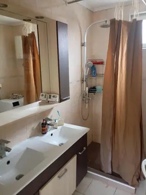 a bathroom with a sink and a shower at Padina-Kovacica in Padina
