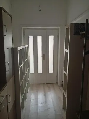 an empty room with three doors and a hallway at Padina-Kovacica in Padina