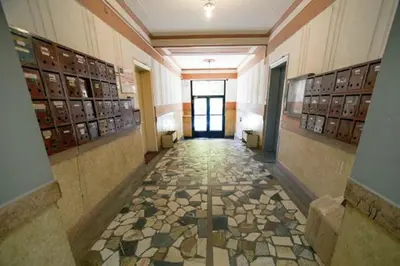 a hallway with a tile floor in a building at Belle Apartments - Square 8 in Belgrade