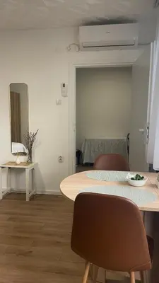 a room with a table and two chairs and a room with a table at Studio 77 in Belgrade