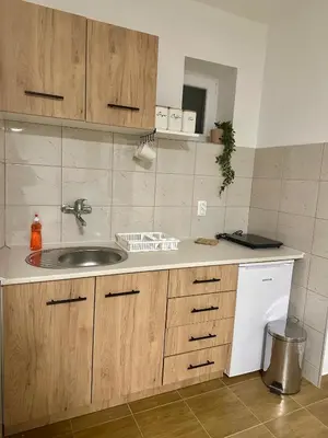 a kitchen with a sink and a counter top at Apartman 8 in Ruma