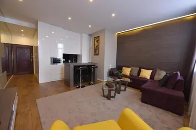 a living room with a couch and a fireplace at Boutique Rooms in Belgrade