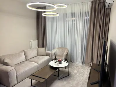 a living room with a couch and a table at BW Aqua Lux Premium Apartman in Belgrade