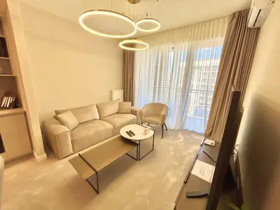 a living room with a couch and a table at BW Aqua Lux Premium Apartman in Belgrade