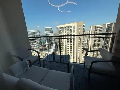 a balcony with couches and a view of a city at BW Aqua Lux Premium Apartman in Belgrade