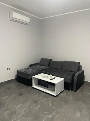 a living room with a couch and a table at Vila Mila Ćirić in Pančevo