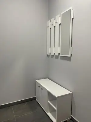a bathroom with a white vanity and a mirror at Vila Mila Ćirić in Pančevo