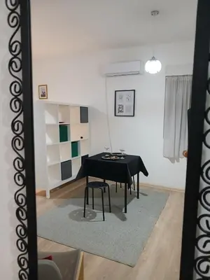 a table in a room with a black table at Apartman Centar Surcin in Surčin