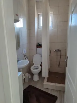 a bathroom with a toilet and a sink at Apartman Centar Surcin in Surčin
